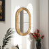 Espejo de pared ovalado con marco de madera elegante